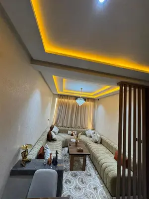 a living room with a couch and a table at Meknes Relax Home in Meknès