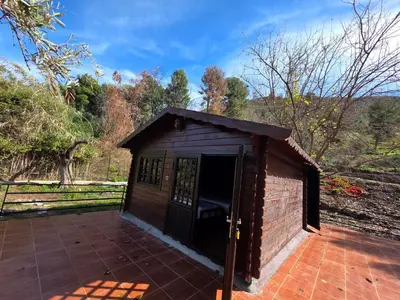a small building with a door on a patio at Auberge RAMZ'S in Beni Mellal
