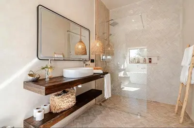 a bathroom with a sink and a mirror at villa Bohème Chic in Had Abdallah Rhiat
