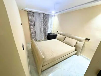 a small room with a couch and a window at Cures & détente Appartement moderne Université EUROMED in Fès