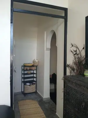 an open door leading into a room with a table at Dar Tissila in Marrakech
