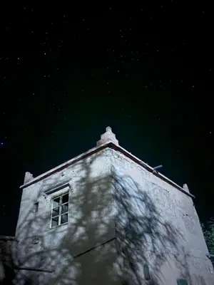 a window on top of a building at night at Zaouit the officialle in Ouarzazate