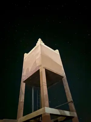 a tall building with the night sky in the background at Zaouit the officialle in Ouarzazate