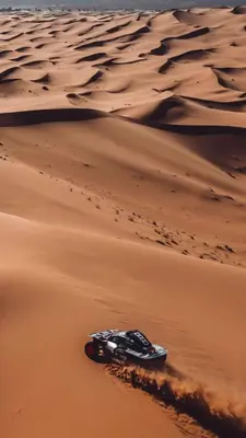 a car in the sand in the desert at SAHARENA Camp in Merzouga