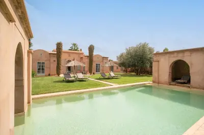 a swimming pool in front of a house at Beautiful Boccara villa, 4 suites and private pool in Chaibate