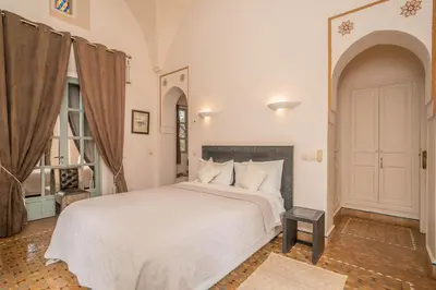 a bedroom with a large white bed in a room at Beautiful Boccara villa, 4 suites and private pool in Chaibate