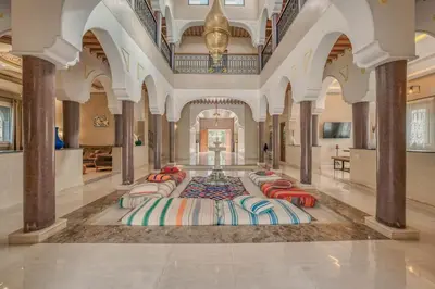 a large room with a row of beds in it at Villa Memories 5bedrooms Space, laughter, relaxation in Marrakesh in Douar bel Rhanodour