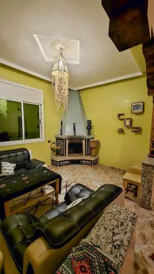 a living room with a couch and a chandelier at luxury desert house merzouga 3BR 2 terraces in Merzouga