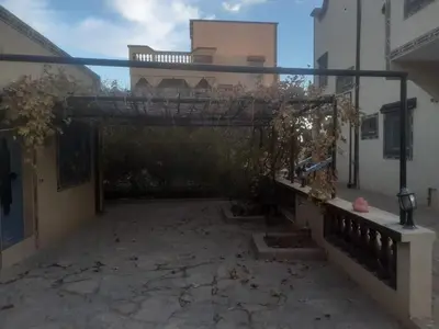 an empty courtyard of a house with a building at maison marocaine atlas in Tinerhir