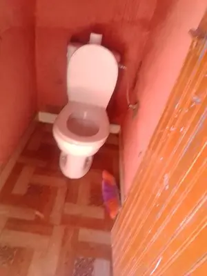a bathroom with a toilet in a room at Gîte Chez habitant in Telouet