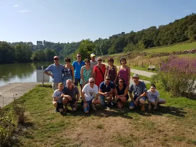a group of people posing for a picture next to a lake at Gîte Chez habitant in Telouet
