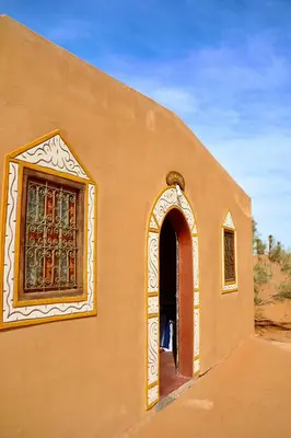 an entrance to a building with a window at Rimal Travel Camp in Mhamid