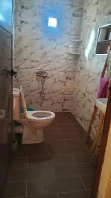 a bathroom with a toilet and a sink at KasbatTaslit in Ouarzazate