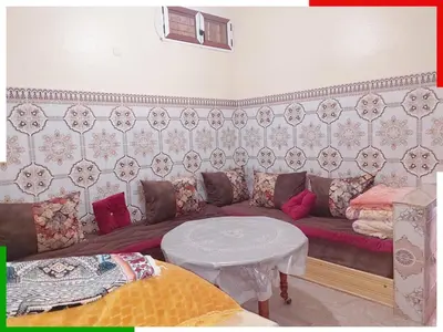 a living room with a couch and a table at Cozy Apartment Near Ouzoud Waterfalls in Azilal