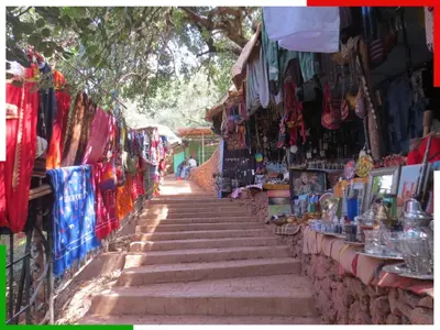 a stairway leading up to a market with shops at Cozy Apartment Near Ouzoud Waterfalls in Azilal