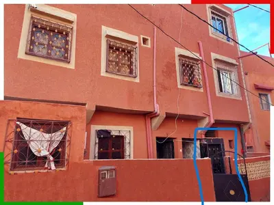 a building with a kite sticking out of its windows at Cozy Apartment Near Ouzoud Waterfalls in Azilal