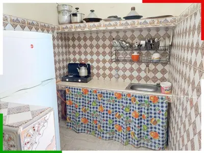a kitchen with a tiled counter with a sink at Cozy Apartment Near Ouzoud Waterfalls in Azilal