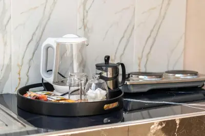 a coffee maker sitting on top of a counter at Mina Home 2 in Oulad Akkou