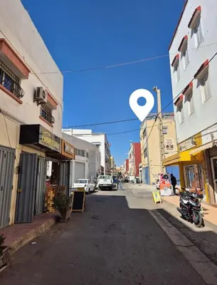 an empty street in a city with buildings at Mina Home 2 in Oulad Akkou