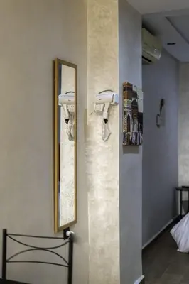 a bathroom with two sinks and a mirror on the wall at Mina Home 2 in Oulad Akkou