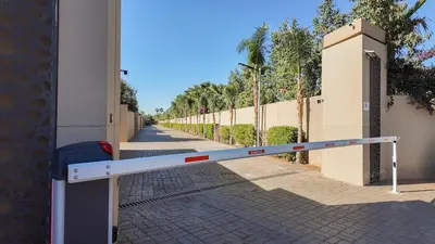 a barrier on a sidewalk next to a building at Villa Ambre in Marrakech