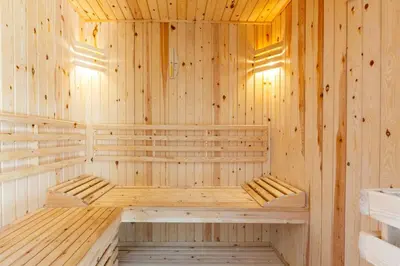 a wooden sauna with two benches in it at Villa Ambre in Marrakech