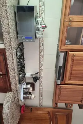 an overhead view of a kitchen with a stove and a tv at Luxurious Accessible Apartment in the Heart of Fes in Fès