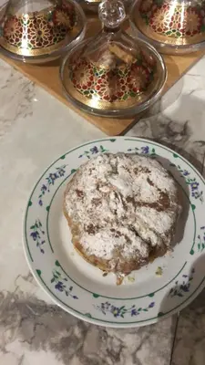 a plate with a piece of food on a table at khamsin home in Fès