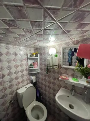 a bathroom with a toilet and a sink at House medina in Fès