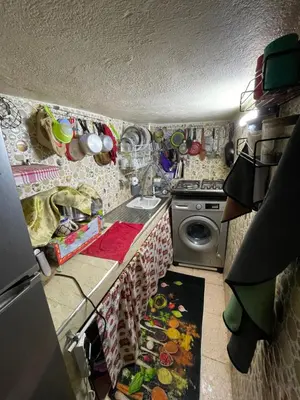 a kitchen with a sink and a washing machine at House medina in Fès