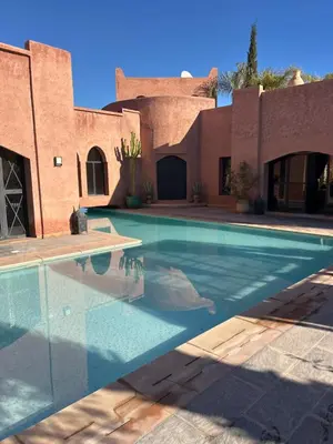 a swimming pool in front of a building at Villa Tamara luxury villa private pool Marrakech in Najem