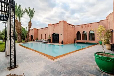 a swimming pool in front of a building at Villa Tamara luxury villa private pool Marrakech in Najem