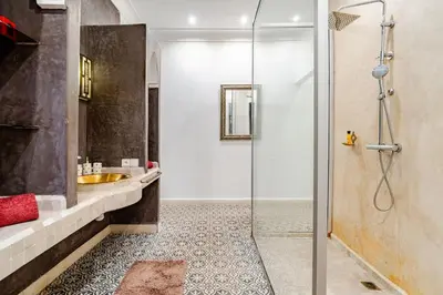 a bathroom with a shower and a sink at Villa Tamara luxury villa private pool Marrakech in Najem