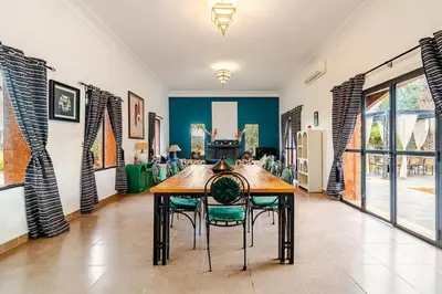 a dining room with a wooden table and chairs at Villa Tamara luxury villa private pool Marrakech in Najem
