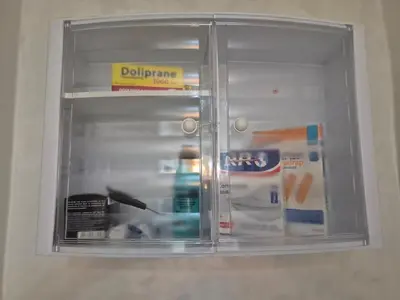 a glass shelf in a refrigerator with products in it at Maison intelligente, idéale pour les familles avec Netflix, parking et ascenseur in Fès