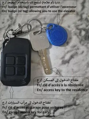 a carabiner with a key on a table at Maison intelligente, idéale pour les familles avec Netflix, parking et ascenseur in Fès