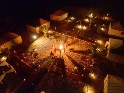 an overhead view of a courtyard at night with lights at Sahara Spirit Luxury Camp in Merdani
