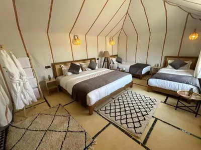 a bedroom with two beds in a room at Bivouac luxury camp in Merzouga