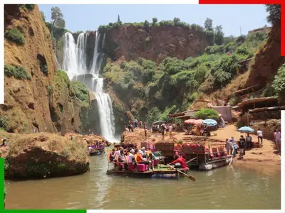 a group of people on boats in front of a waterfall at Central apartment for families near the waterfall in Azilal
