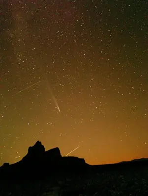 a star trails in the night sky over a mountain at Milky Way Chigaga Camp in El Gouera