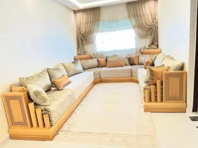 a living room with a couch and a window at Appartement Diyar Saiss in Meknès