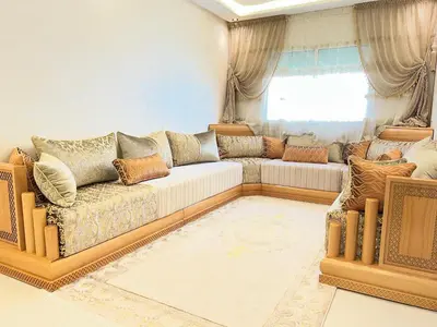 a living room with a couch and a window at Appartement Diyar Saiss in Meknès