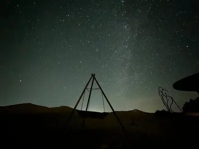 a starry night with a tent in the desert at Azalai Haven Camp in Merzouga