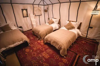 a bedroom with two beds in a room at Azalai Haven Camp in Merzouga