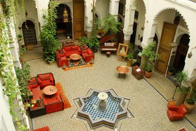 an overhead view of a living room with red furniture at EL Ghalia in Fès