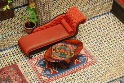 a purse sitting on top of a tiled floor at EL Ghalia in Fès