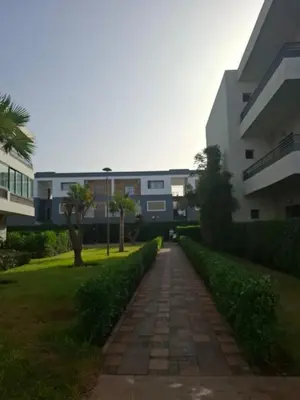 a walkway in front of a building at Beach-front paradise with parking and pool in Oulad Akkou