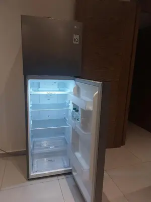 an empty refrigerator with its door open in a room at Al Anouar B40 in Oulad Akkou