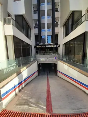a large building with a red line in the middle of it at Al Anouar B40 in Oulad Akkou