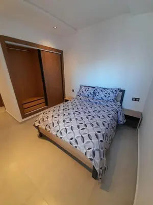 a bedroom with a bed in a room at Al Anouar B40 in Oulad Akkou